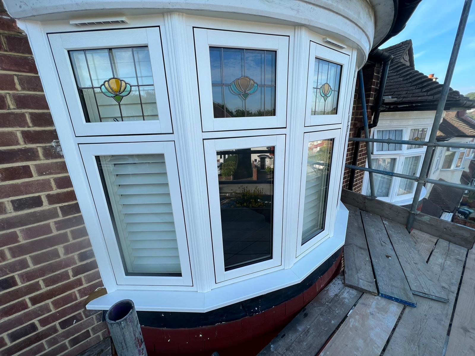 White uPVC bay window being installed in a home